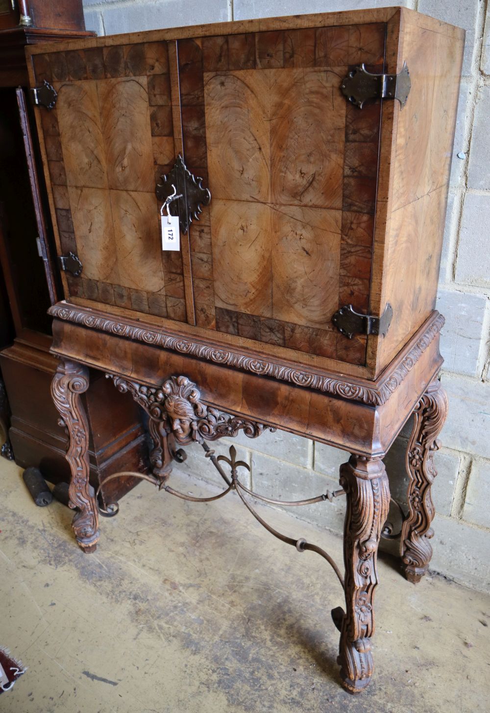 An Italian style walnut oyster veneered cabinet on stand, width 96cm depth 50cm height 147cm